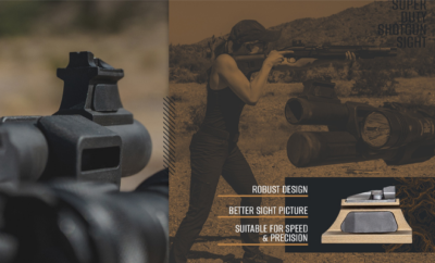 Woman holding a shotgun.