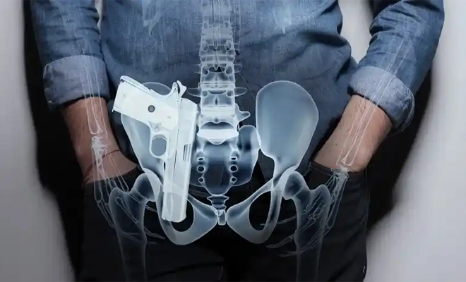 A x-ray illustration of a person carrying a handgun.