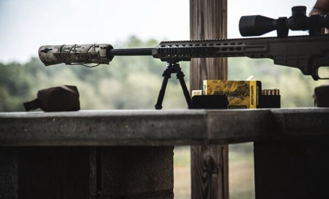 A rifle with a Suppressor and Suppressor Cover