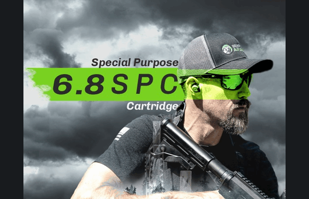 A man holding a black rifle.