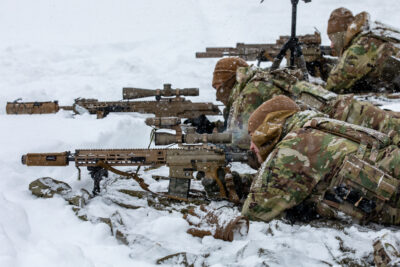 U.S. Paratroopers shooting rifles from the prone position.