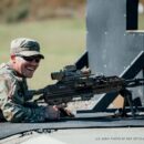 A soldier shooting a rifle from the prone position.