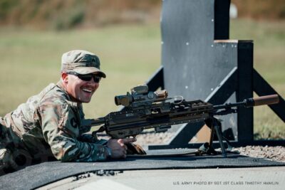 A soldier shooting a rifle from the prone position.
