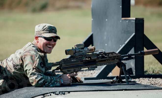 A soldier shooting a rifle from the prone position.